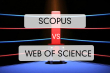 червоний куток боксерського рингу на якому напис: Scopus vs Web of Science